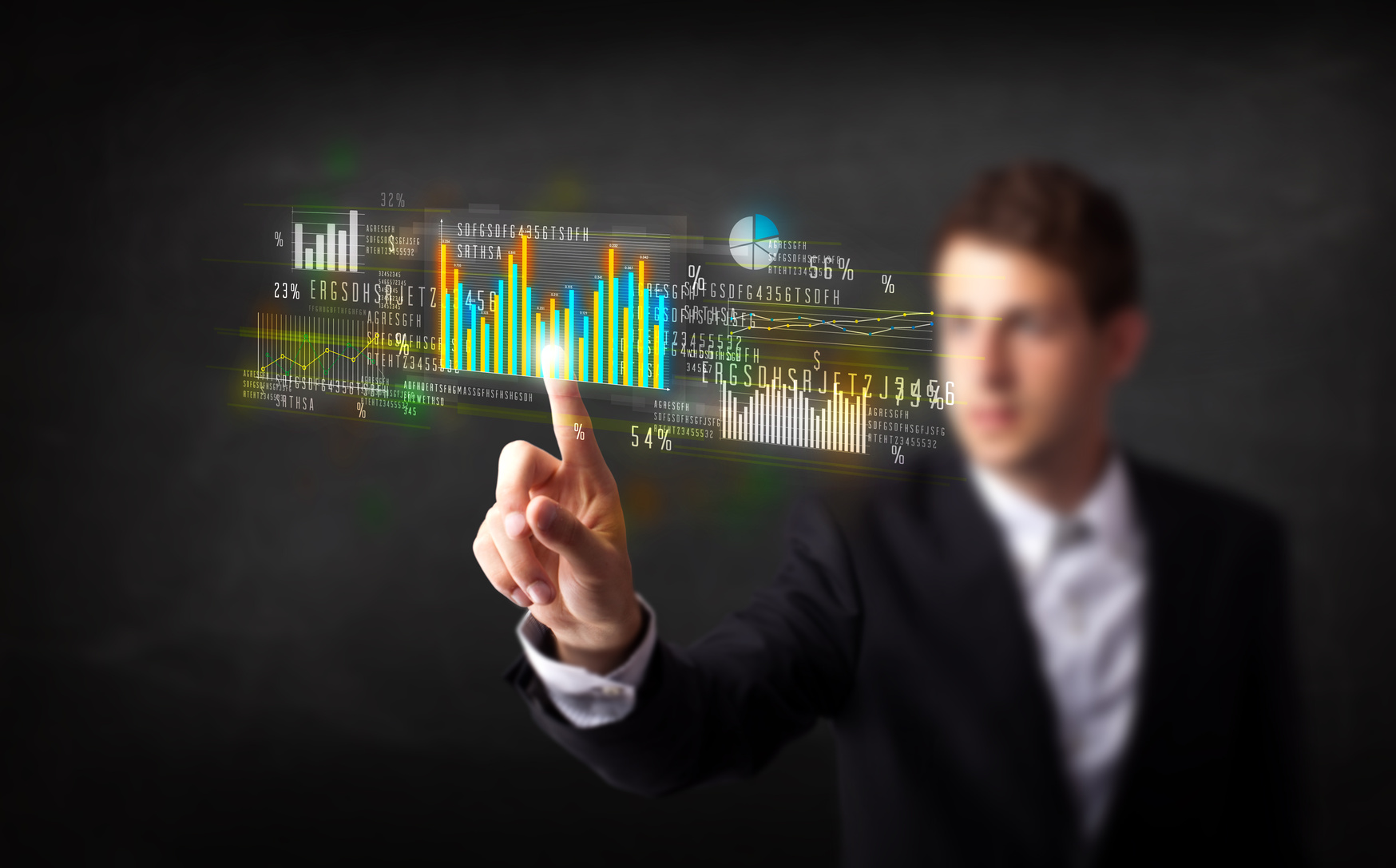 Business person touching colorful charts and diagrams
